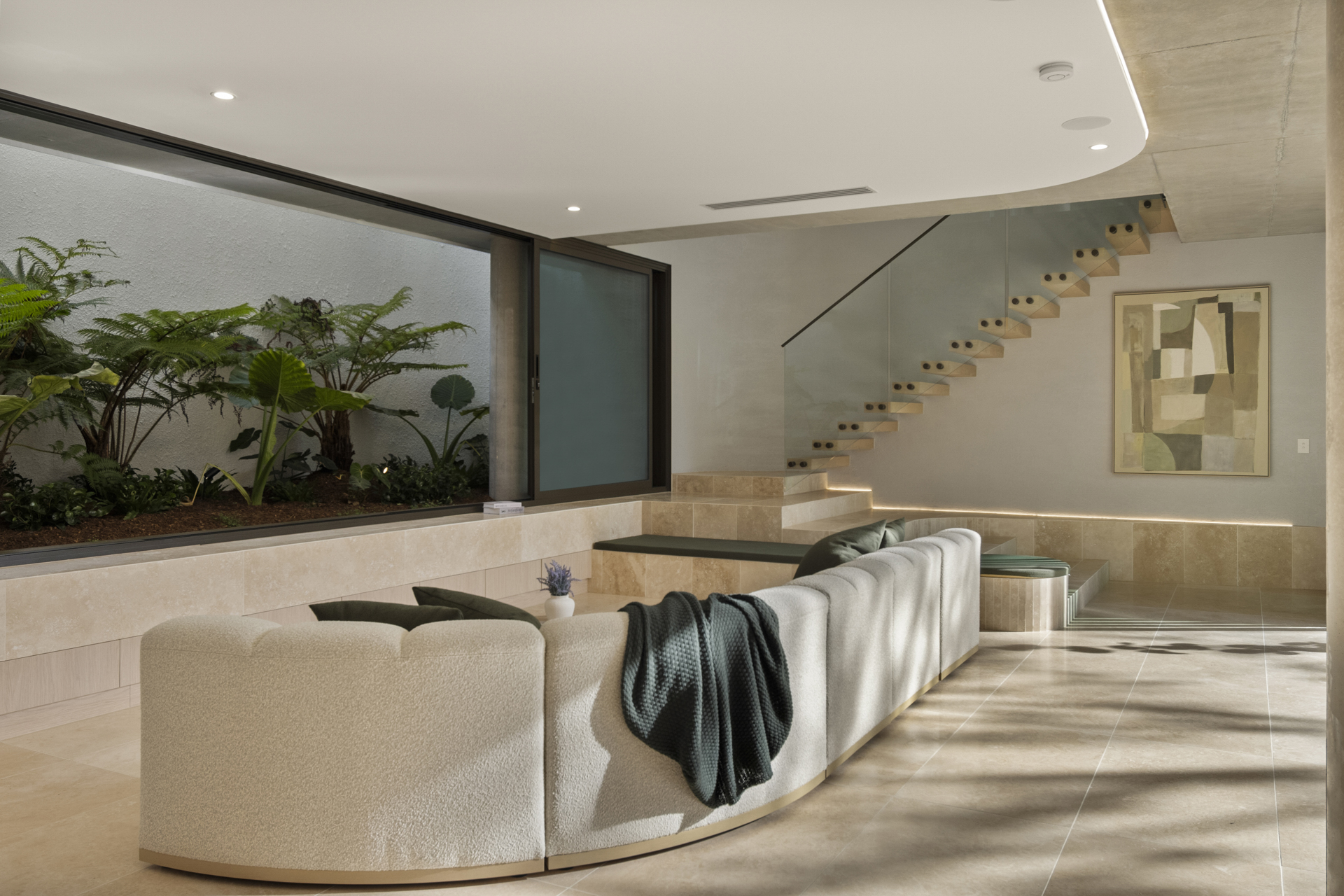 Living room opening completely to the courtyard garden
