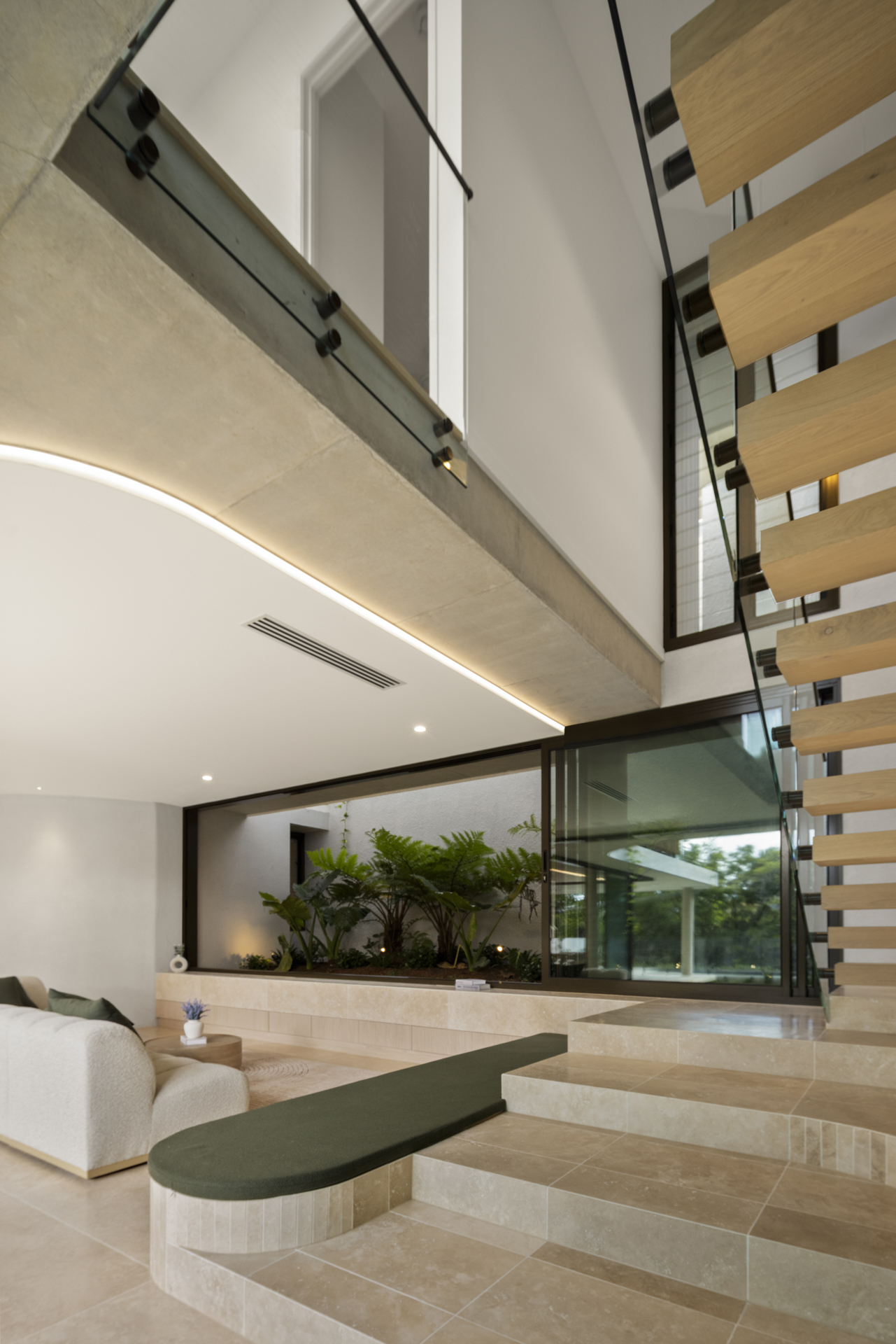 Floating staircase with integrated architectural lighting