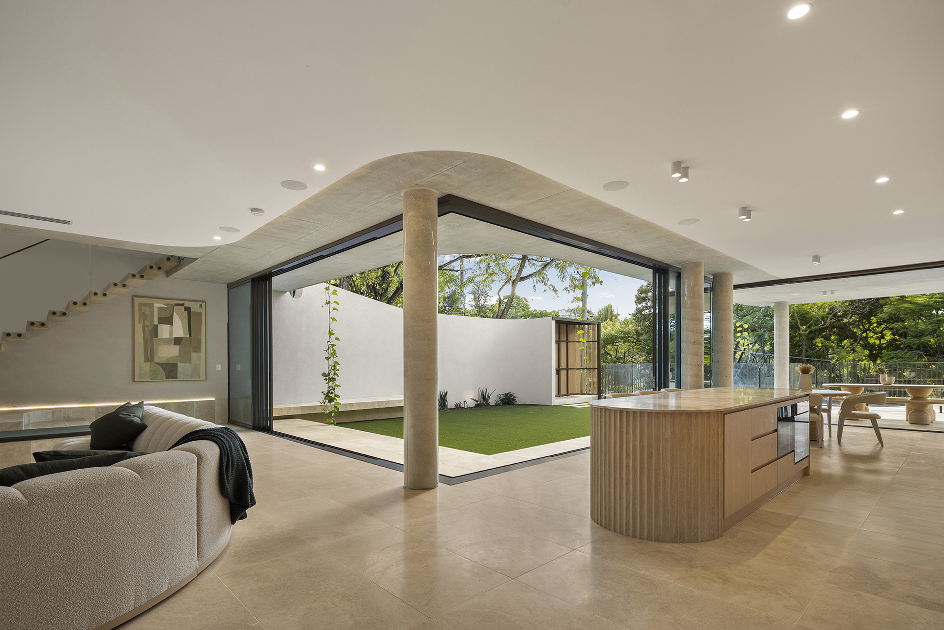 Open plan living and kitchen connected to the garden
