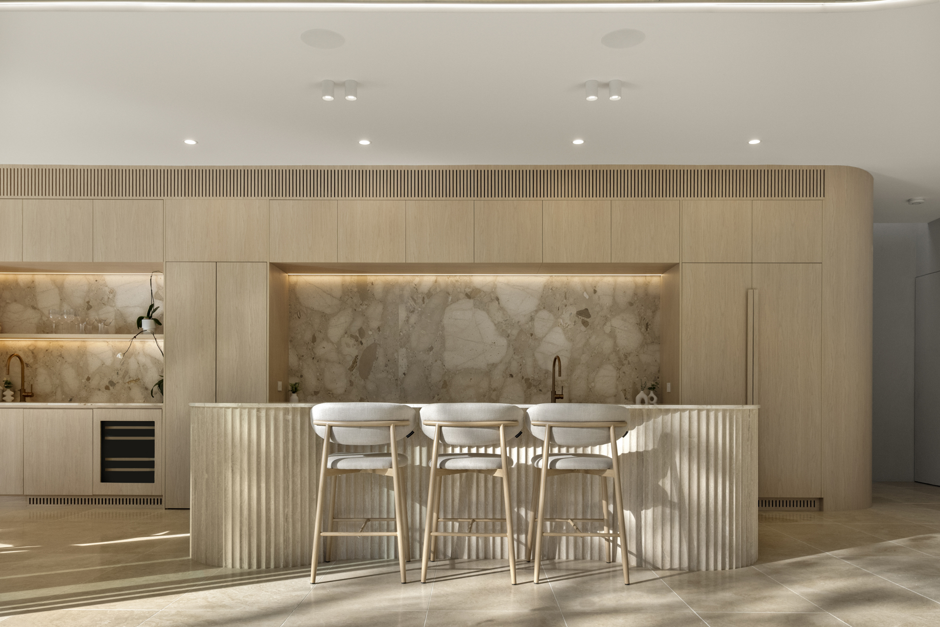 Fluted travertine kitchen island