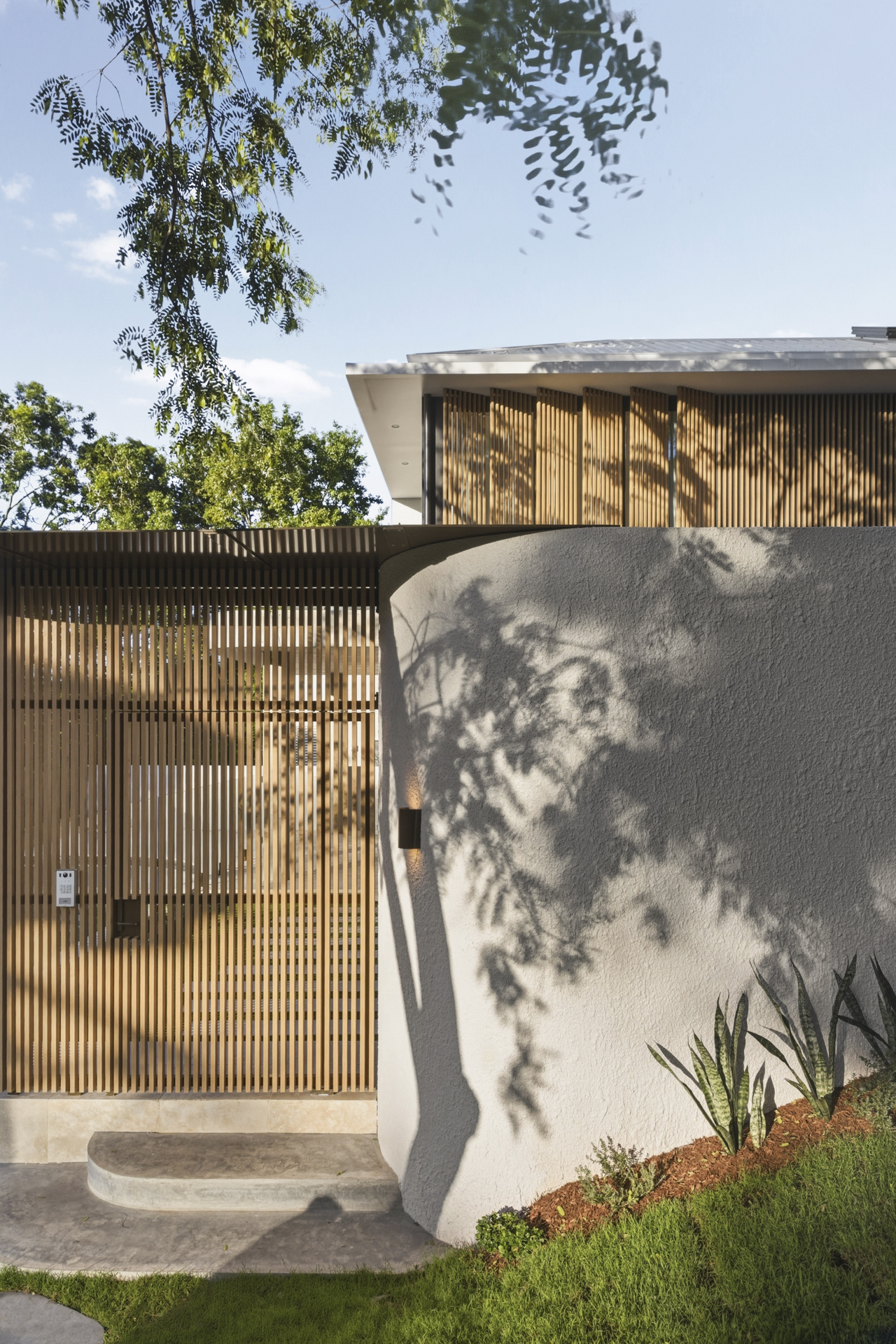 Private gatehouse entrance surrounded by greenery